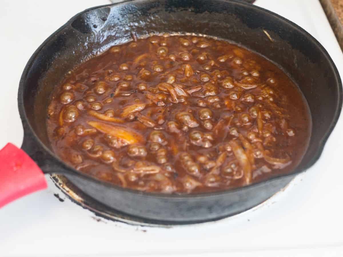 sweet bbq onion sauce simmering in a skillet
