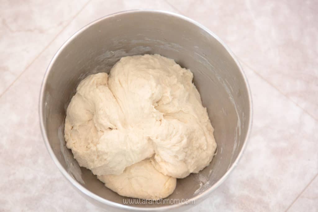 cinnamon bread dough in bowl, rising