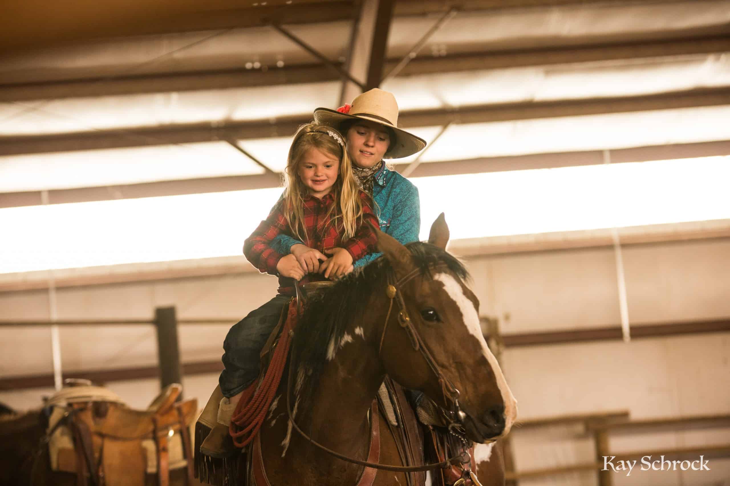 Esh Branding in Colorado - cowgirl riding a horse