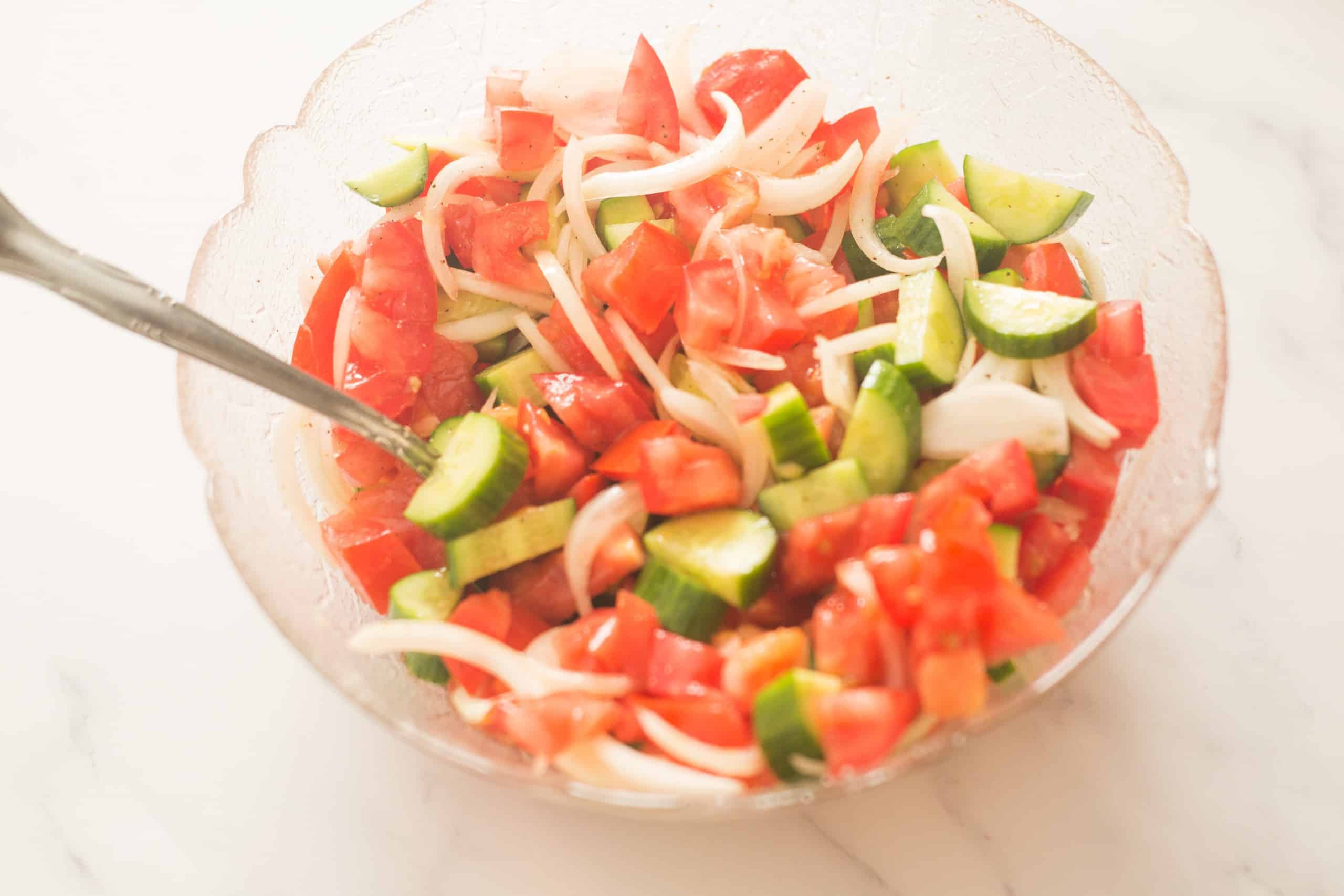 bowl of tomato and cucumber salad