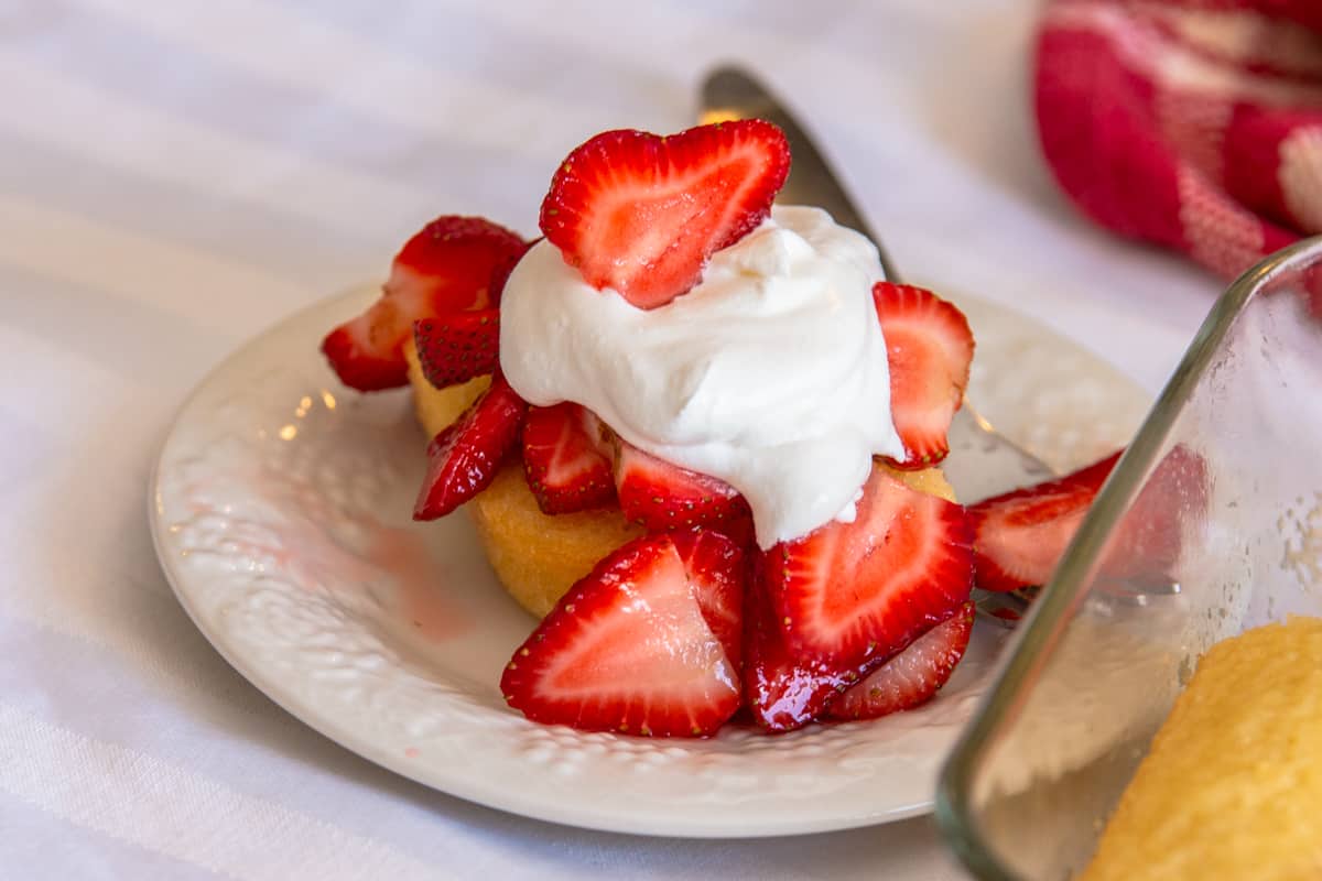 pound cake with strawberries and whipped cream on top