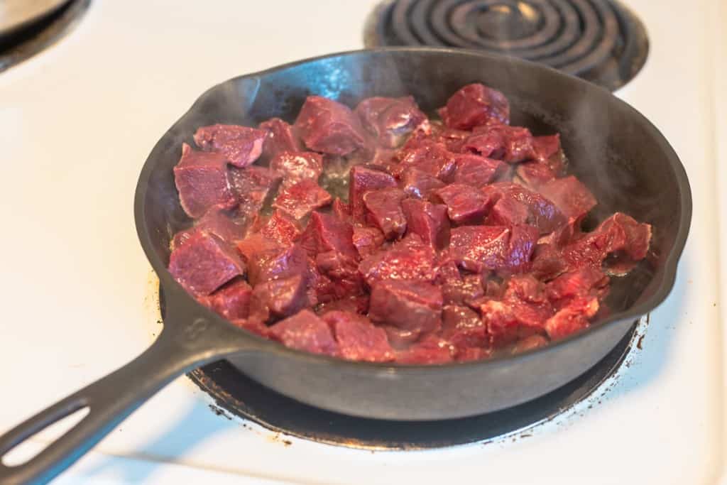 stew meat in frying pan