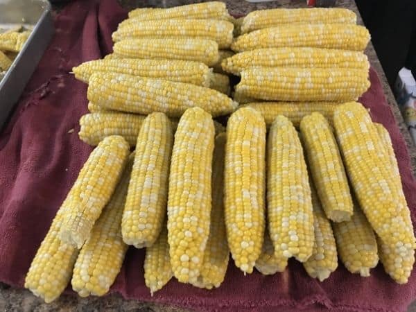 sweet corn piled on counter
