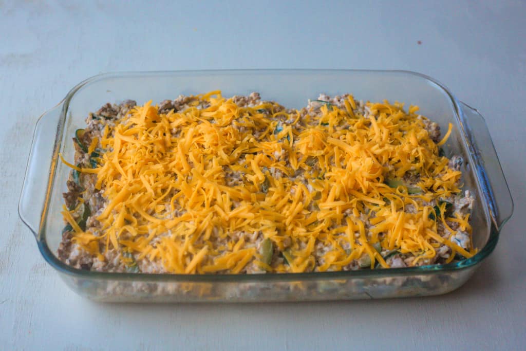 unbaked zucchini ground beef casserole in glass pan