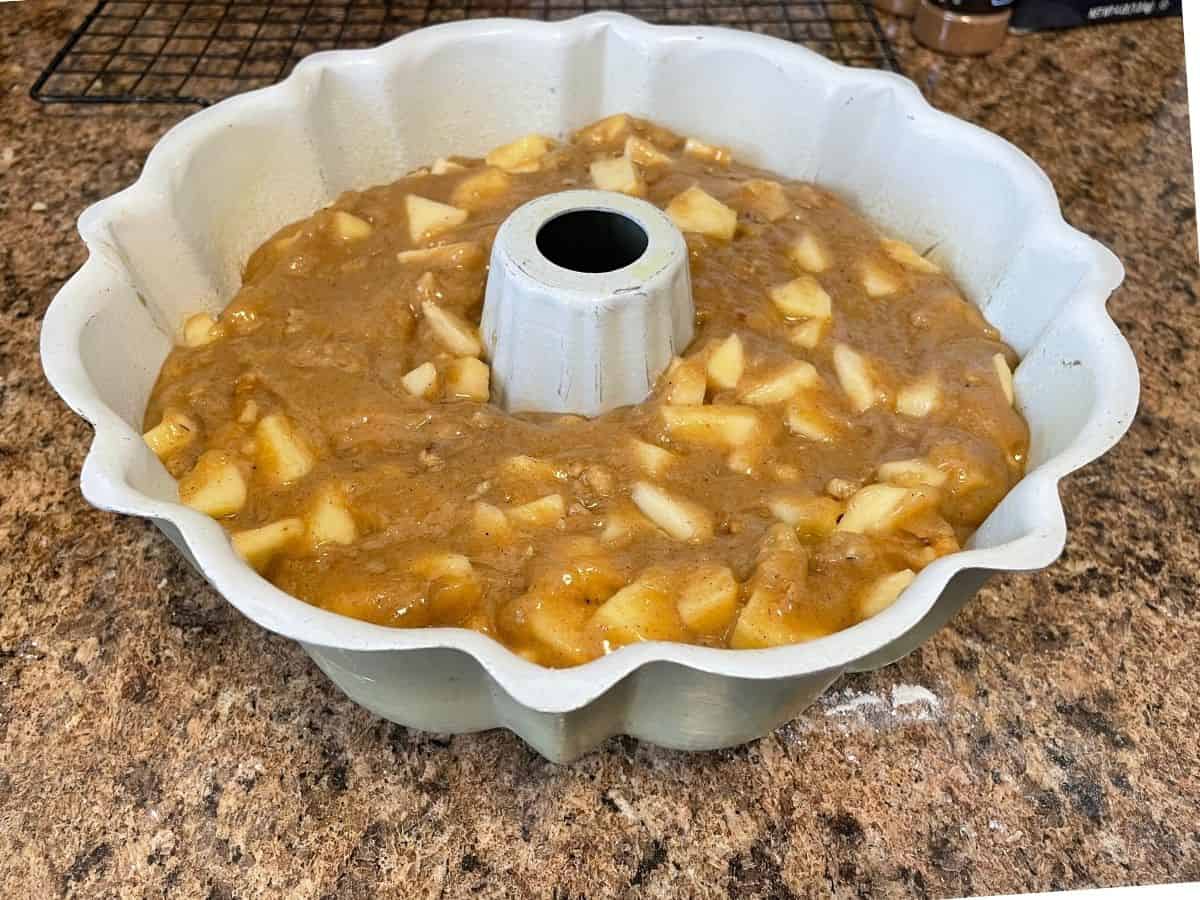Apple cake batter in pan ready to bake