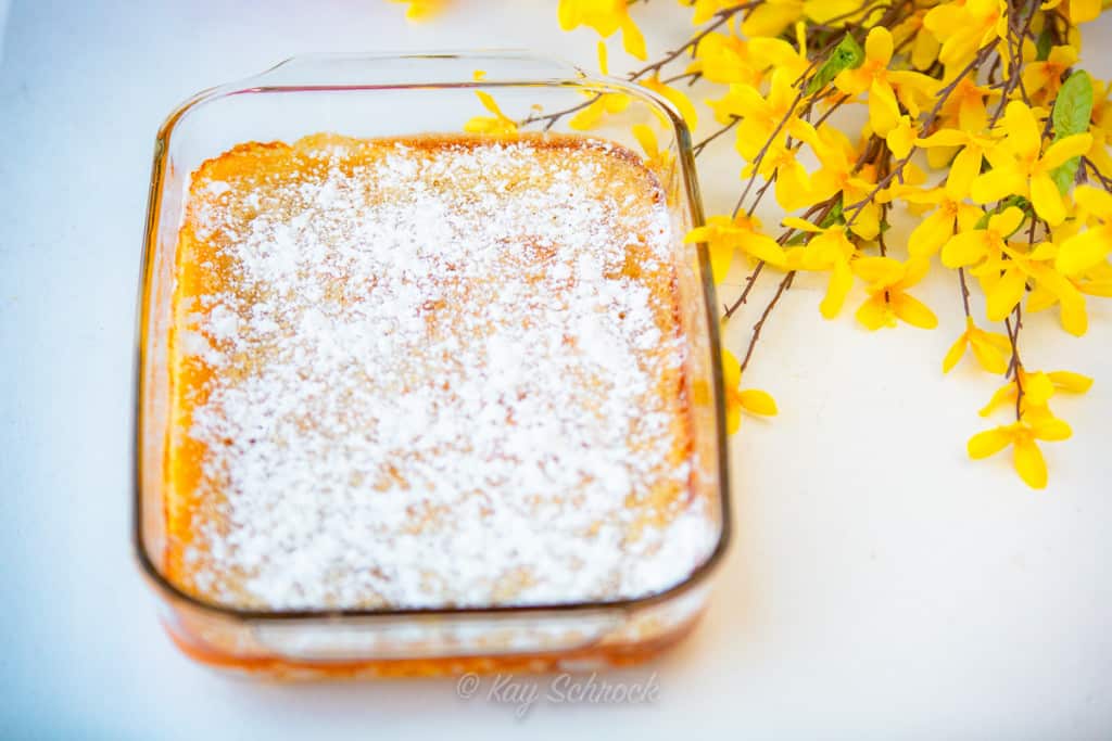 pan of lemon bars and yellow flowers