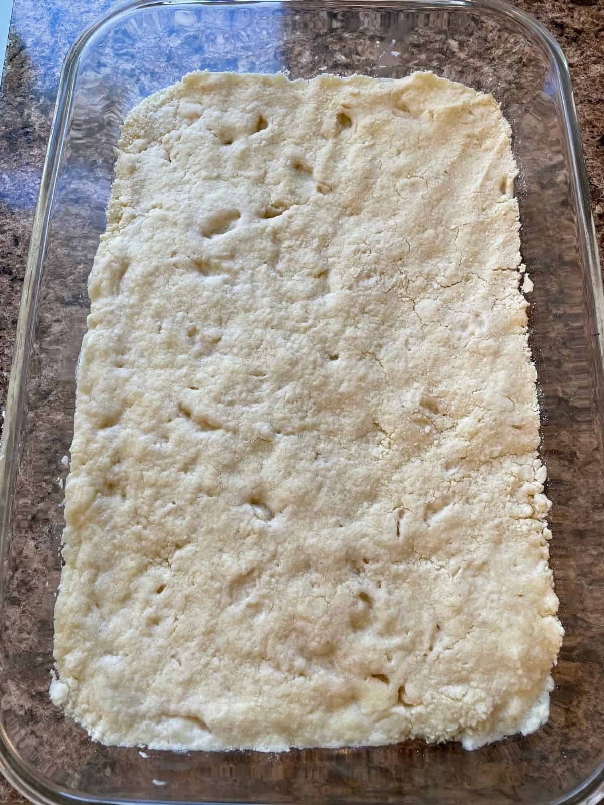 shortbread crust in a glass pan, baked