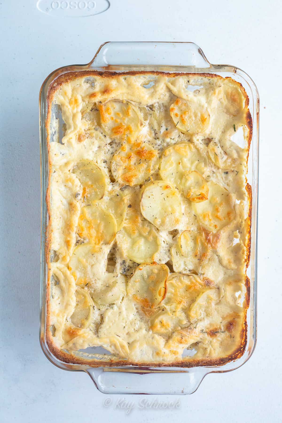 scalloped potatoes in glass baking dish
