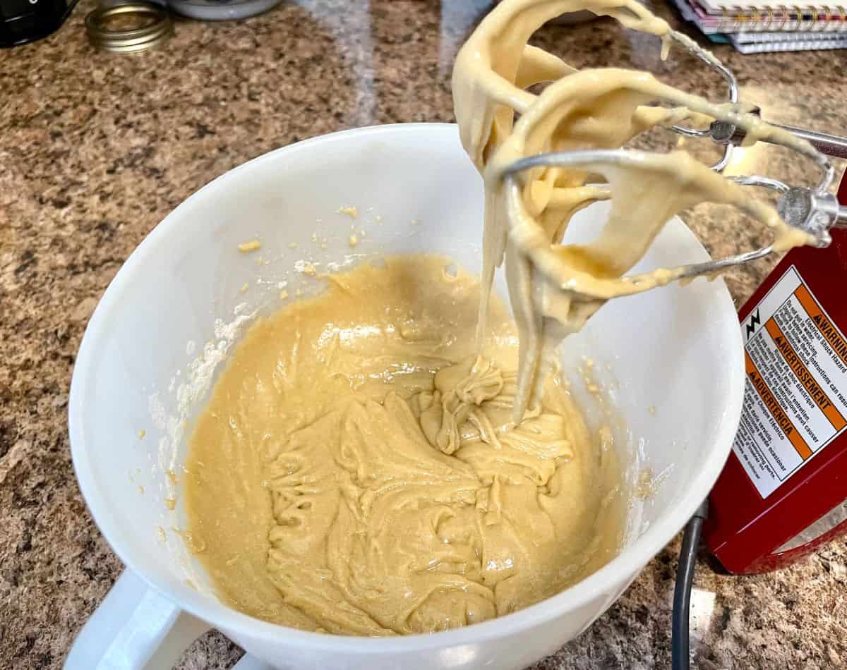 blonde brownie batter in bowl with mixer