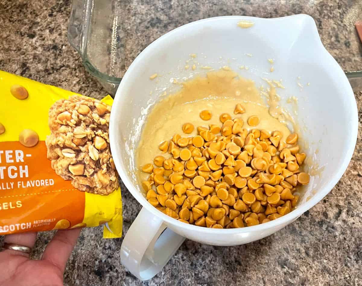 butterscotch baking chips in a bowl of batter