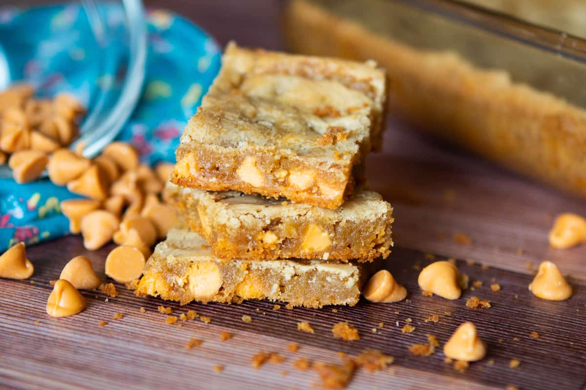 butterscotch squares stacked on counter 