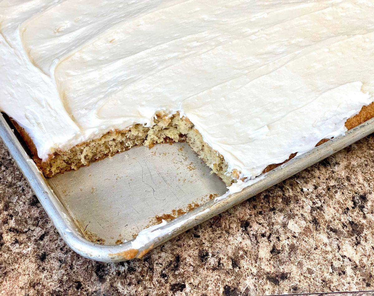 frosted banana bars with one piece out of corner
