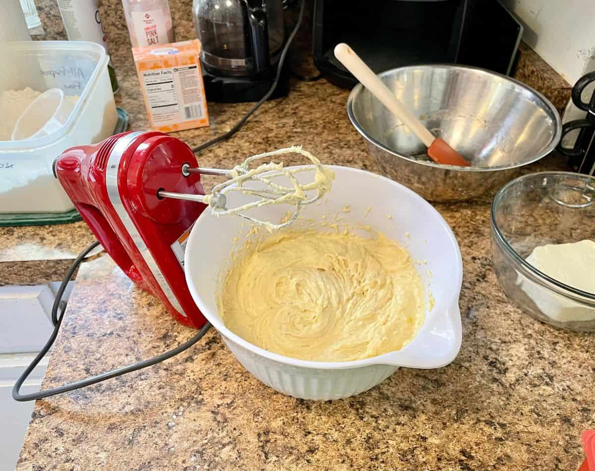 bowl of banana bar batter beside electric mixer