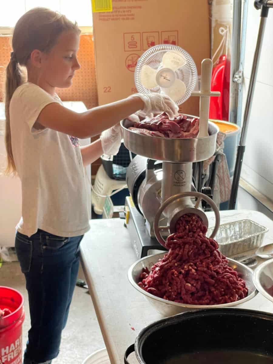 girl processing meat