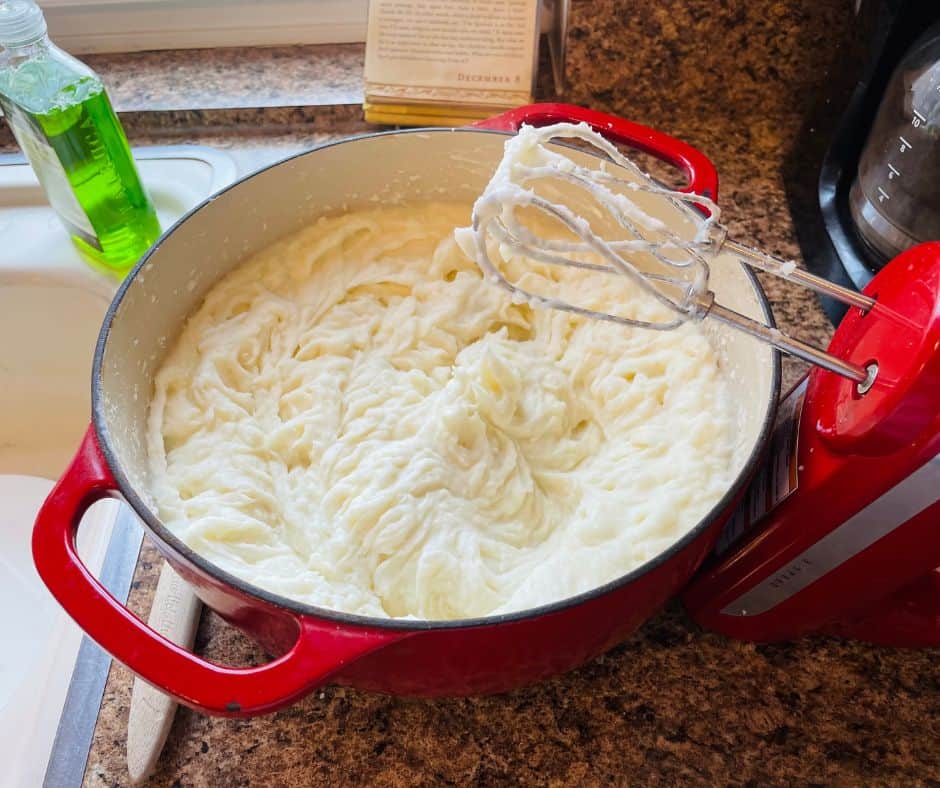 Fluffy Mashed Potatoes in a red dutch oven