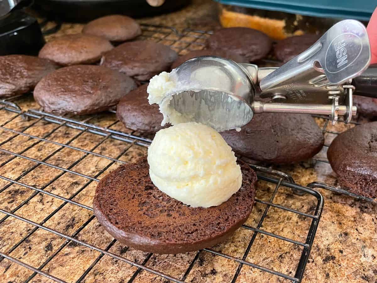 frosting being placed on cookie