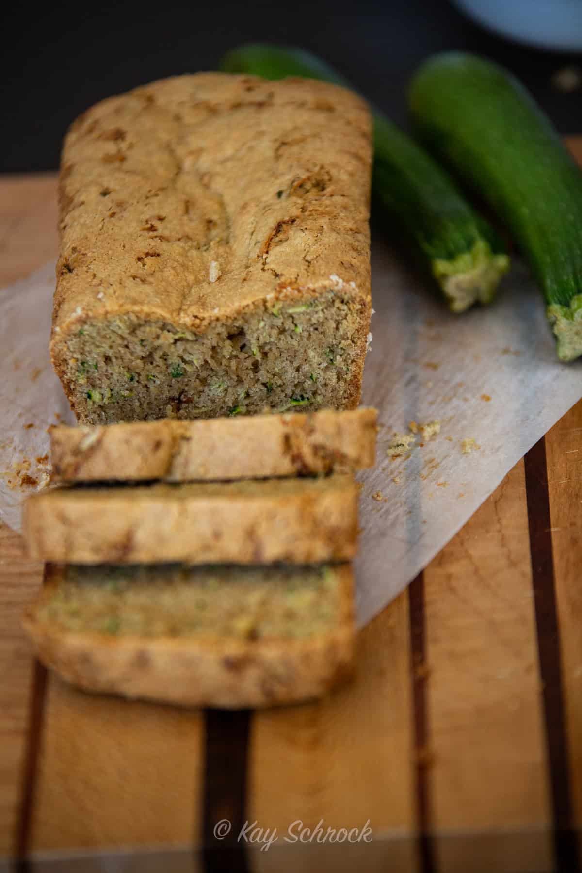 Zucchini Bread sliced on breadboard